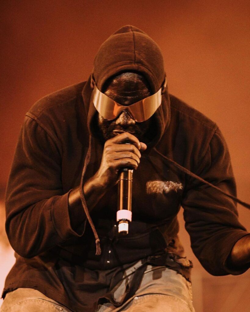 Kayne West wearing Yeezy x Gap sunglasses during his concert