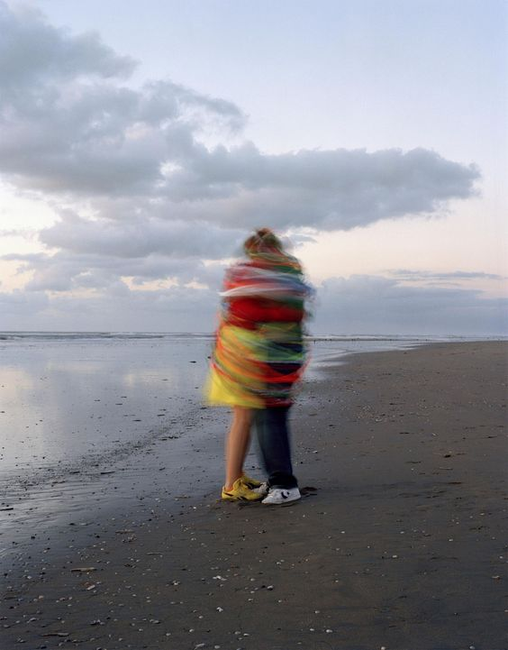 couple hugging beach